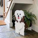 Havanese dog planter filled with fresh flowers is placed in the room