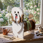 Havanese dog planter filled with fresh flowers is placed in the room