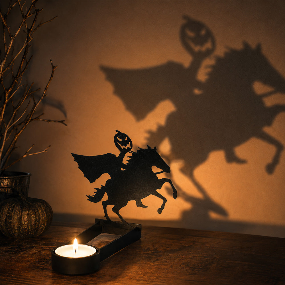 Headless horseman halloween metal candle holder casting a spooky shadow on the wall
