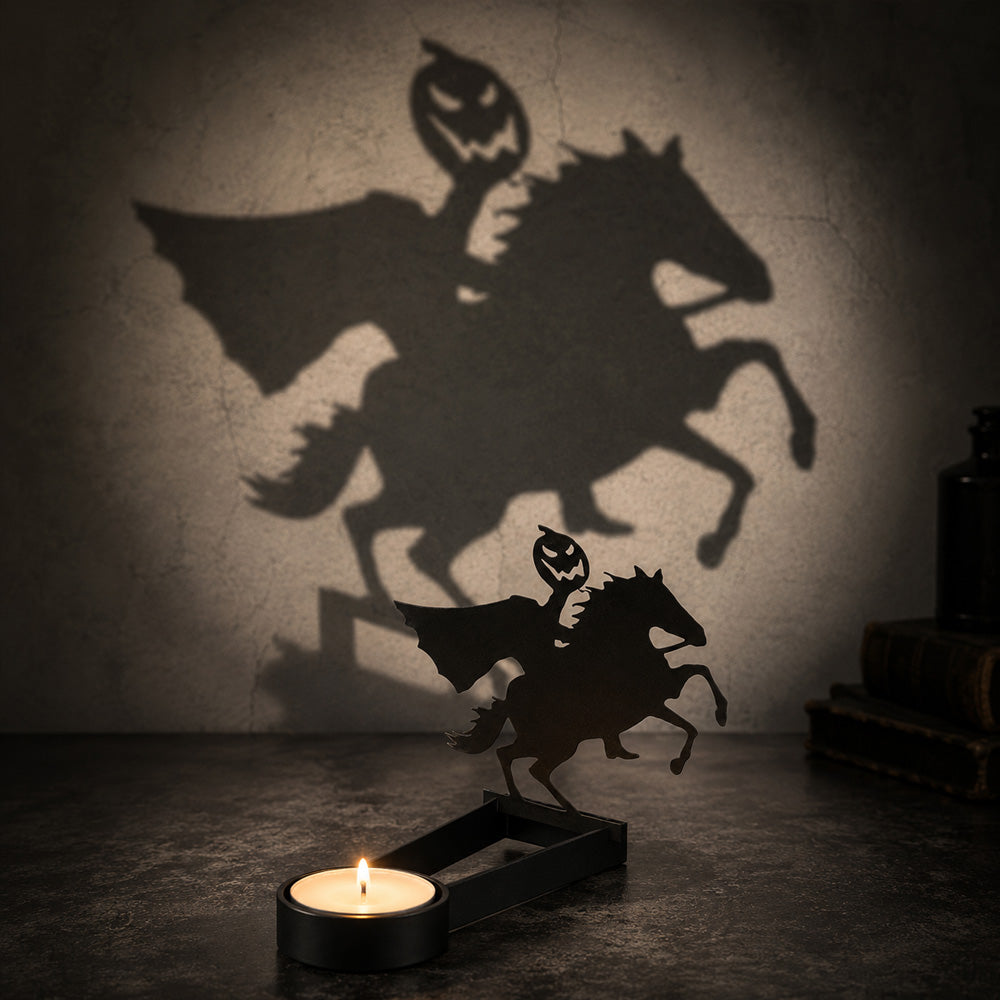 Headless horseman halloween metal candle holder casting a spooky shadow on the wall