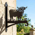 Highland cow silhouette metal hanging basket bracket mounted on outdoor wall for plant decoration
