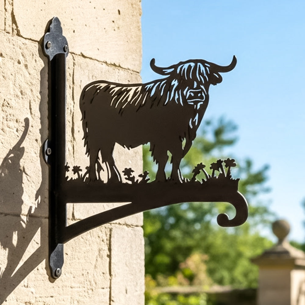 Highland cow silhouette metal hanging basket bracket mounted on outdoor wall for plant decoration