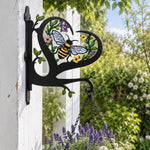 Bee metal hanging basket bracket mounted on outdoor wall for plant decoration
