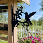 Hummingbird with honeysuckle metal hanging basket bracket mounted on outdoor wall for plant decoration