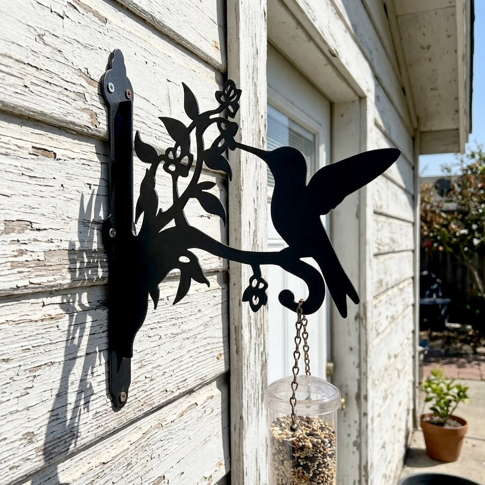 Hummingbird with honeysuckle metal hanging basket bracket mounted on outdoor wall for plant decoration