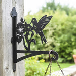 Hummingbird with morning glory metal hanging basket bracket mounted on outdoor wall for plant decoration