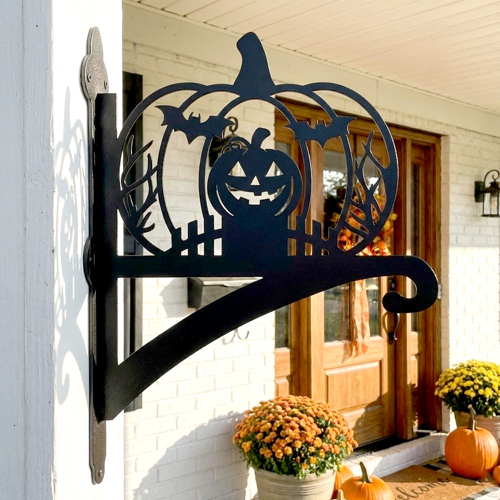 Jack-o’-lantern metal hanging basket bracket mounted on outdoor wall for plant decoration