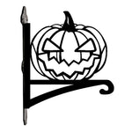 Jack-o’-lantern metal hanging basket bracket mounted on outdoor wall for plant decoration