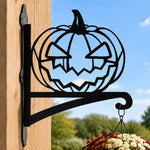 Jack-o’-lantern metal hanging basket bracket mounted on outdoor wall for plant decoration