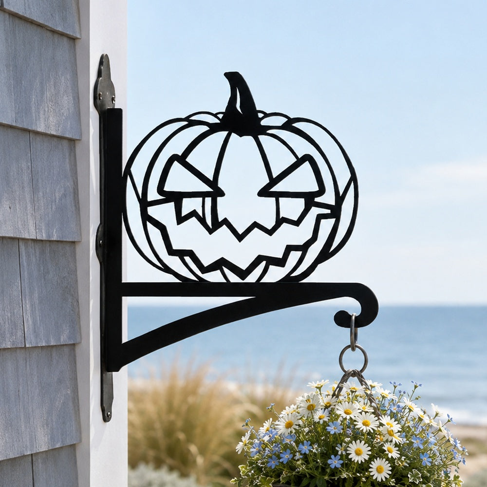 Jack-o’-lantern metal hanging basket bracket mounted on outdoor wall for plant decoration