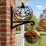 Jack-o’-lantern metal hanging basket bracket mounted on outdoor wall for plant decoration