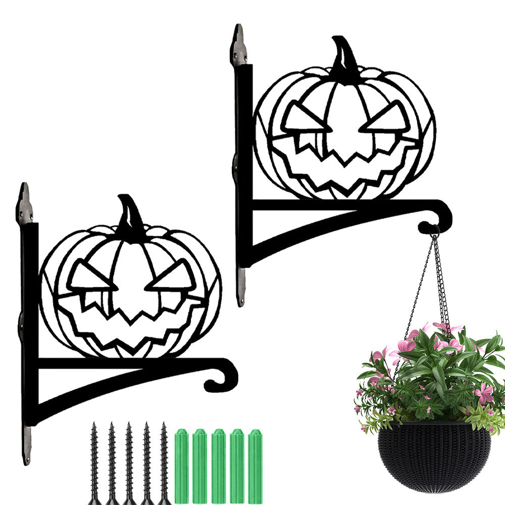 Jack-o’-lantern metal hanging basket bracket mounted on outdoor wall for plant decoration