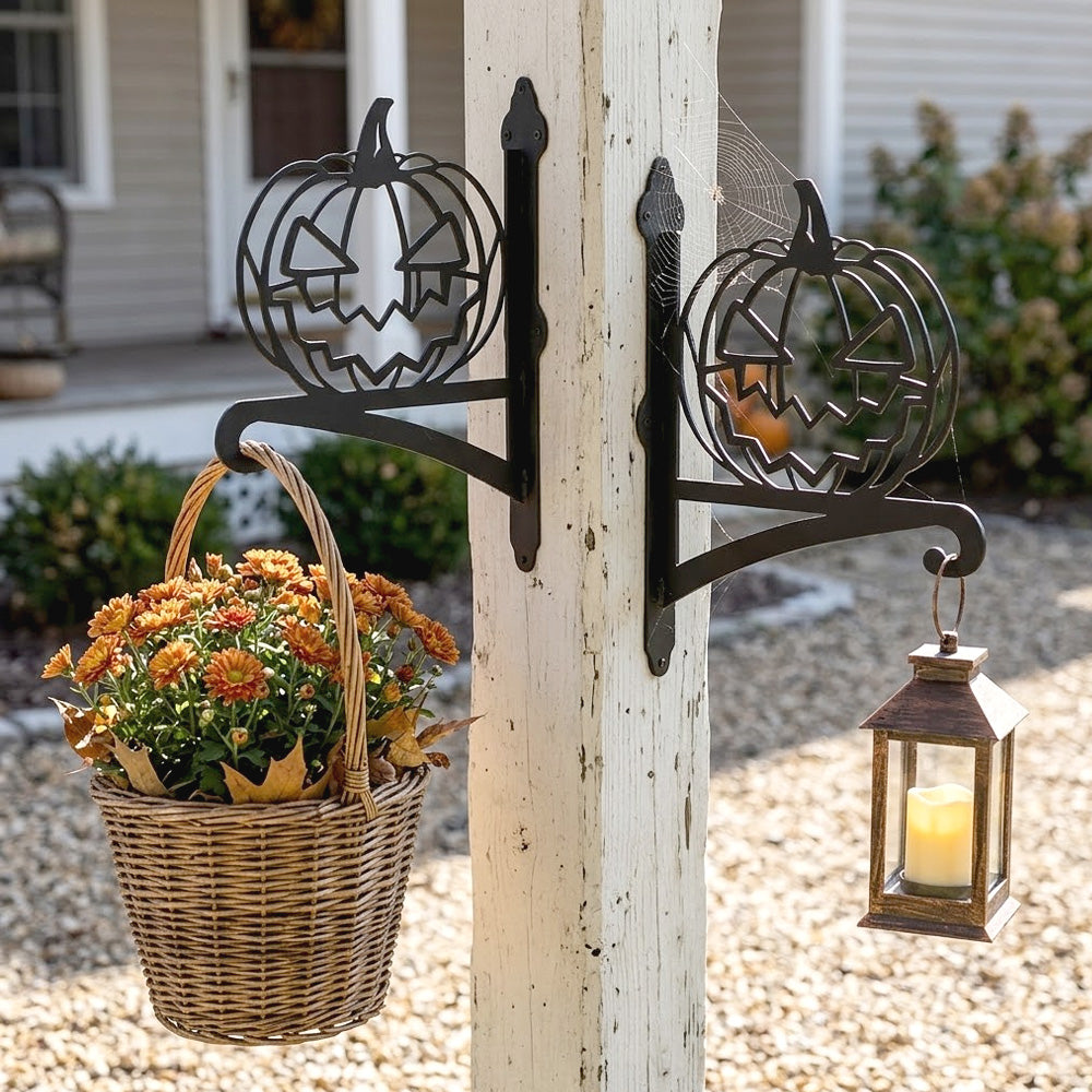 Jack-o’-lantern metal hanging basket bracket mounted on outdoor wall for plant decoration