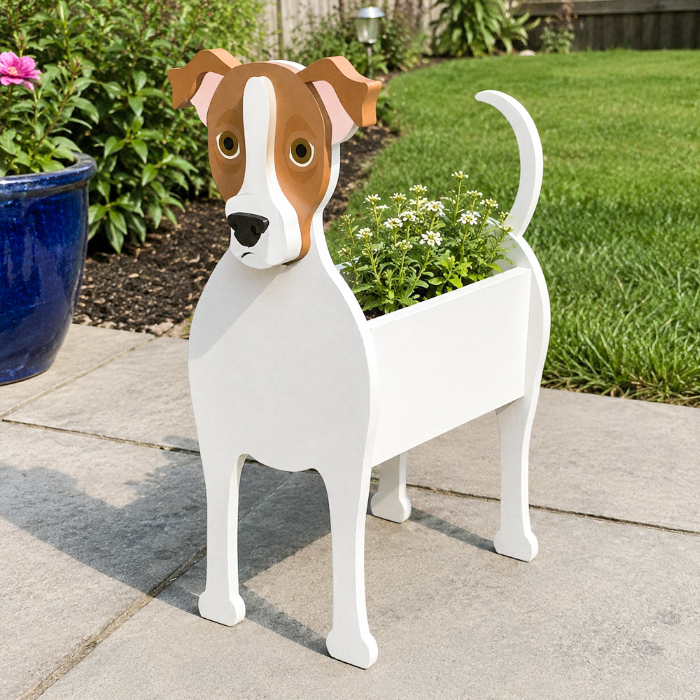 Jack Russell Terrier dog planter filled with fresh flowers is placed in the garden