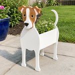 Jack Russell Terrier dog planter filled with fresh flowers is placed in the garden
