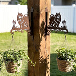 Keeshond metal hanging basket bracket mounted on outdoor wall for plant decoration