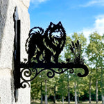 Keeshond metal hanging basket bracket mounted on outdoor wall for plant decoration