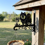 Keeshond metal hanging basket bracket mounted on outdoor wall for plant decoration