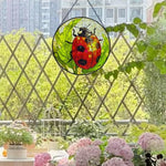 ladybug on green leaves stained glass suncatcher window hanging, suitable for home and garden decoration.