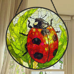ladybug on green leaves stained glass suncatcher window hanging, suitable for home and garden decoration.