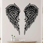 Black metal Layered Angel Wings wall art with intricate cutout details displayed on the wall