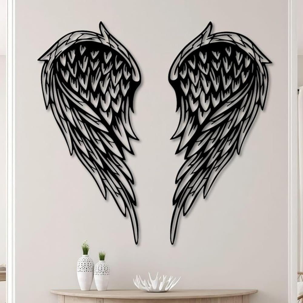 Black metal Layered Angel Wings wall art with intricate cutout details displayed on the wall