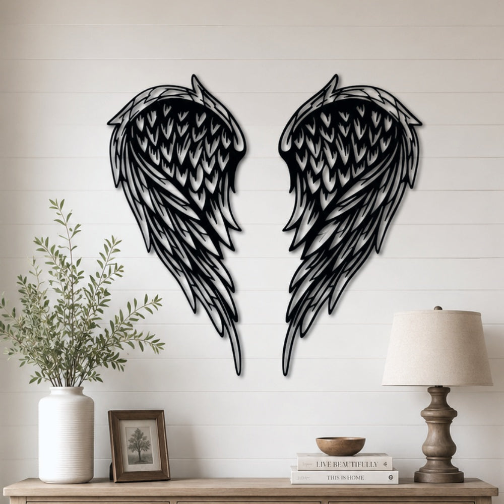 Black metal Layered Angel Wings wall art with intricate cutout details displayed on the wall