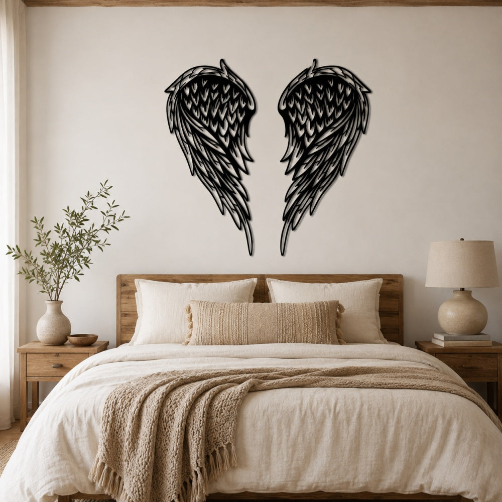 Black metal Layered Angel Wings wall art with intricate cutout details displayed on the wall