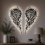 Black metal Layered Angel Wings wall art with Soft White LED Lighting displayed on the wall