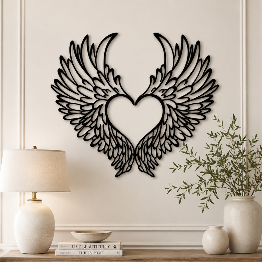 Black metal Love Angel wings wall art with intricate cutout details displayed on the wall