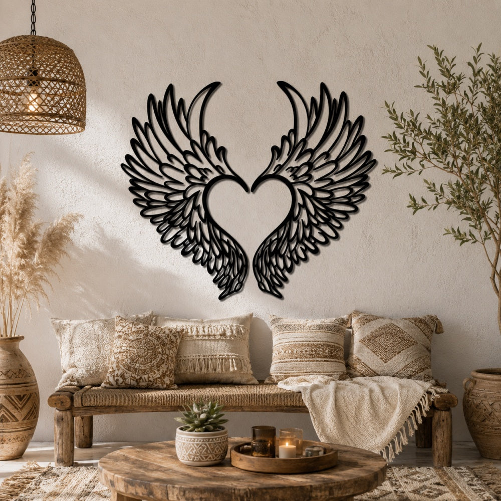 Black metal Love Angel wings wall art with intricate cutout details displayed on the wall