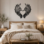 Black metal Love Angel wings wall art with intricate cutout details displayed on the wall