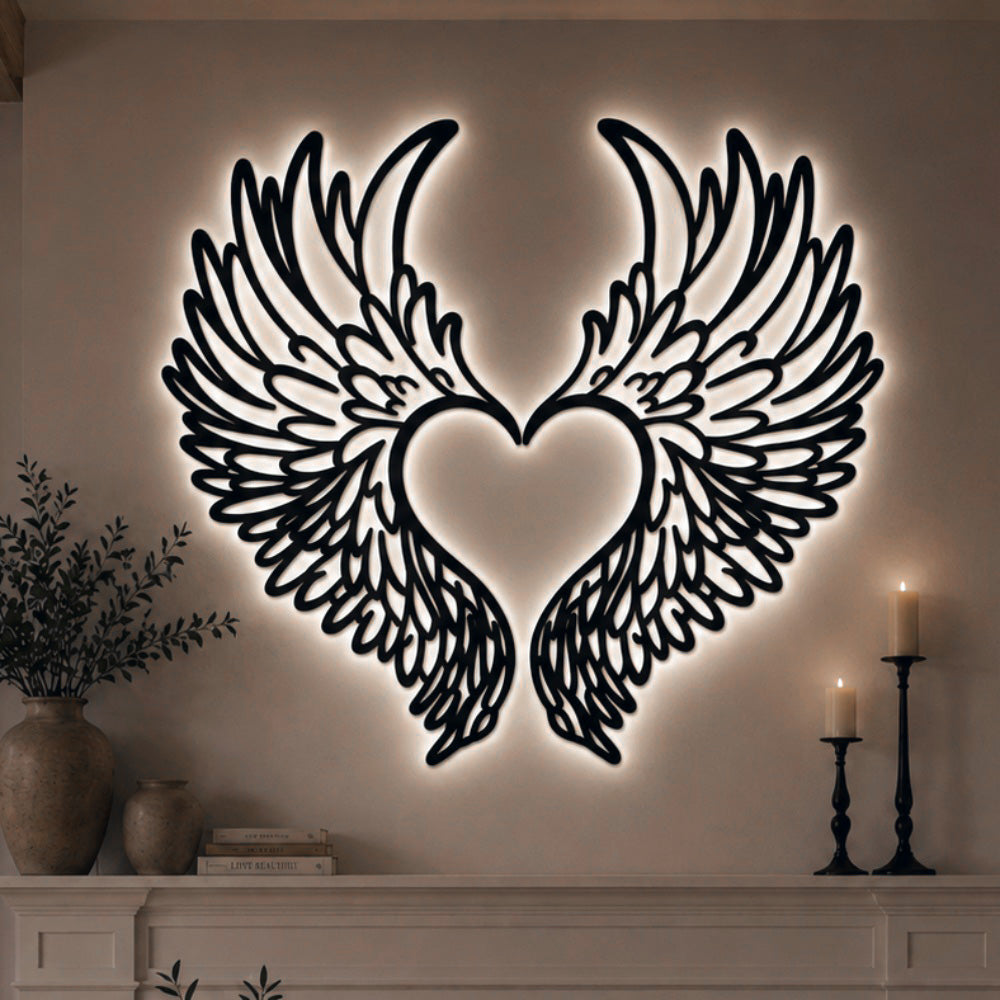 Black metal Love Angel wings wall art with Soft White LED Lighting displayed on the wall