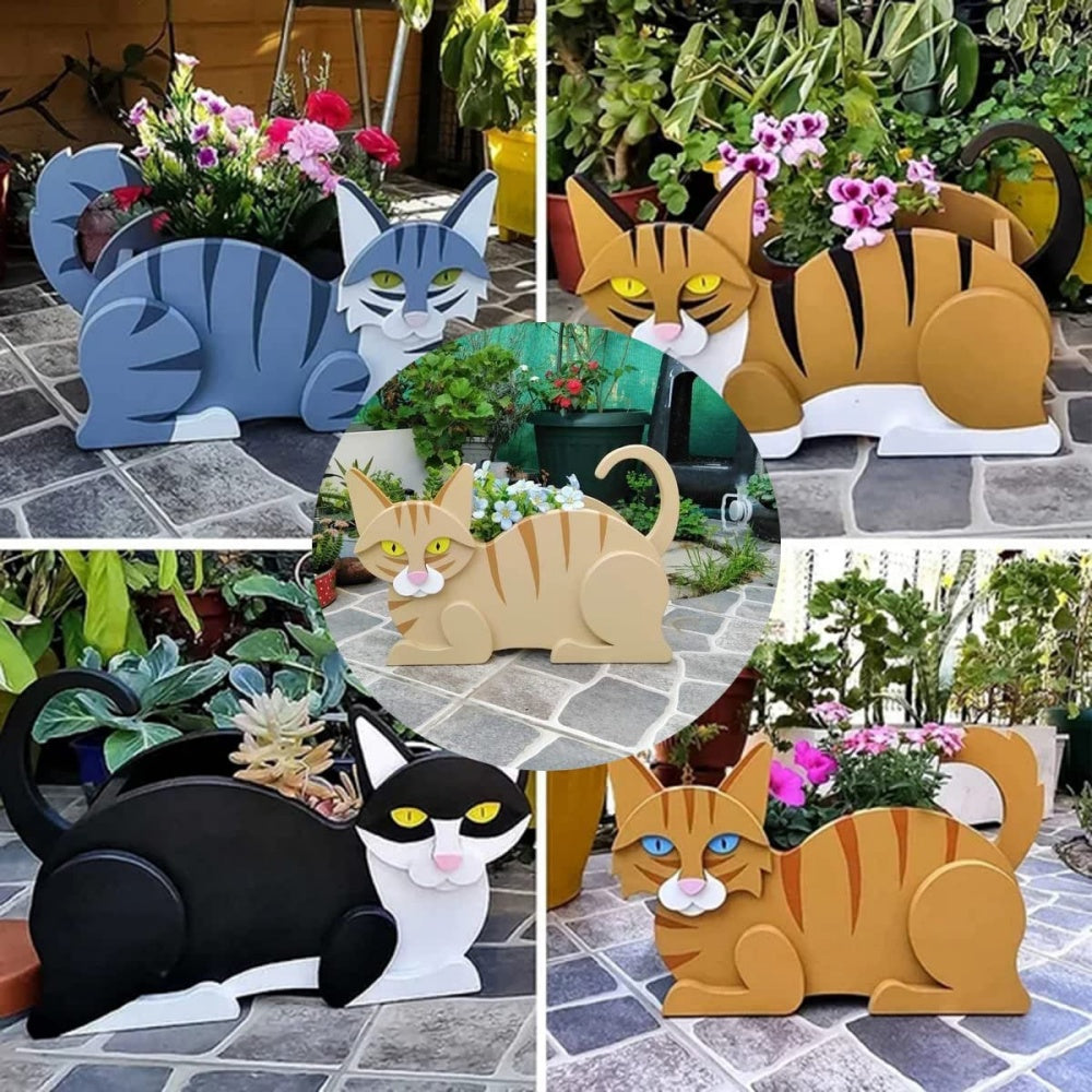 Lying cats planter filled with fresh flowers is placed in the garden