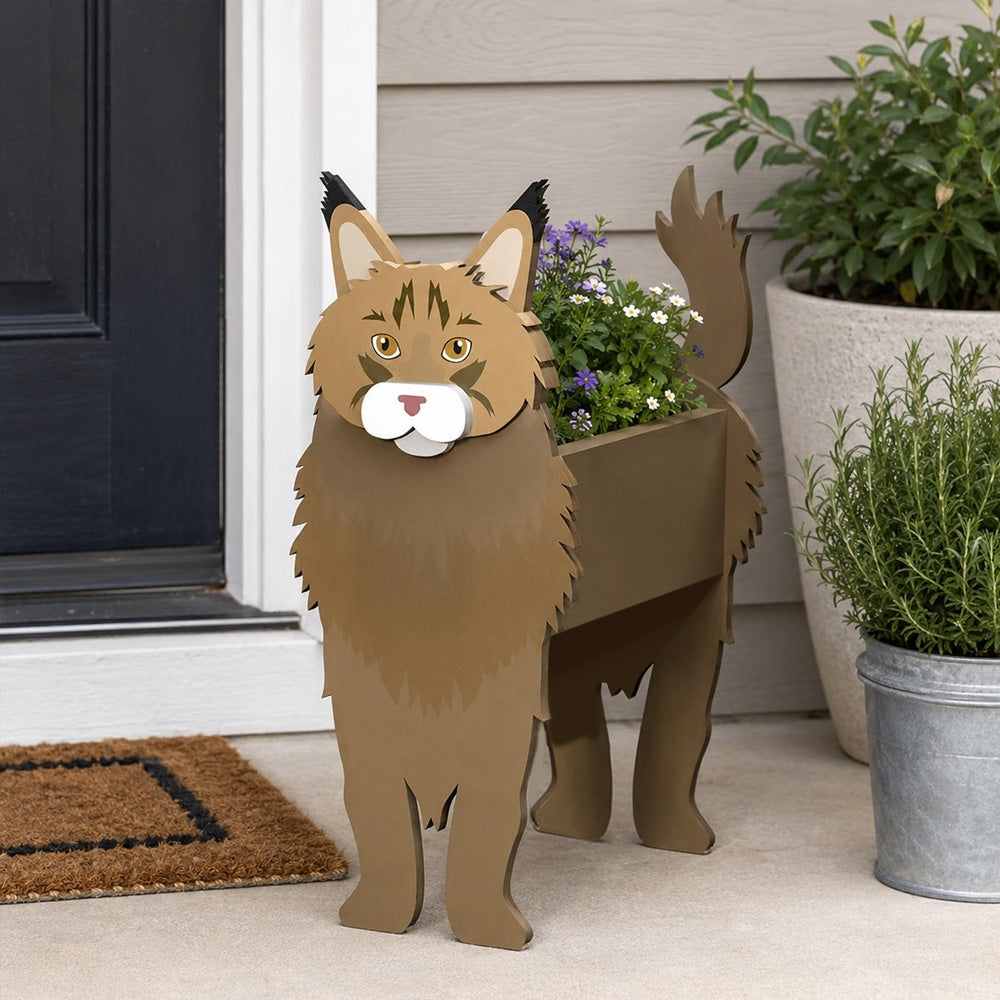 Maine Coon cat planter filled with fresh flowers is placed in the garden