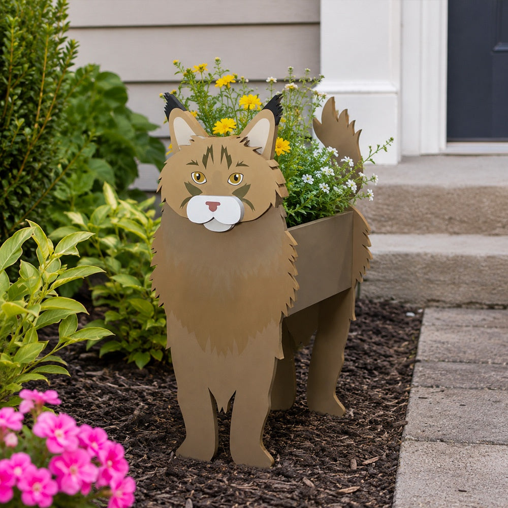 Maine Coon cat planter filled with fresh flowers is placed in the garden