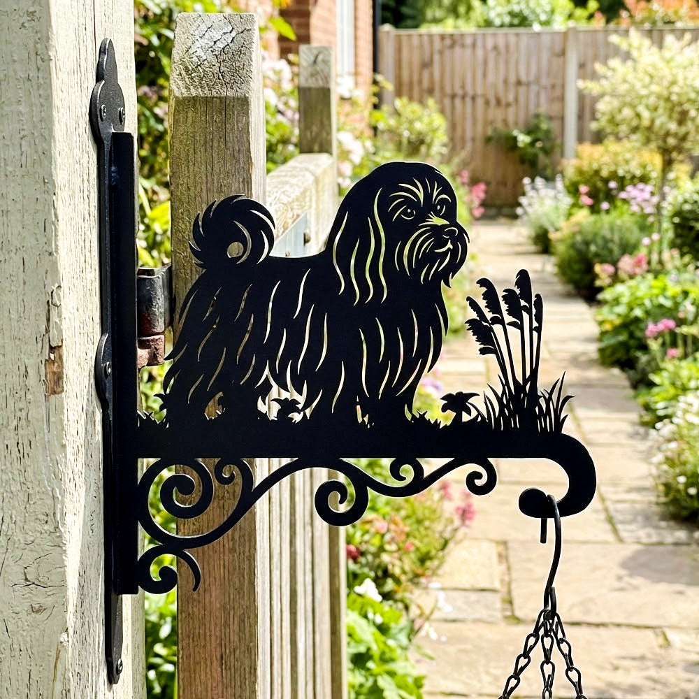 Maltese metal hanging basket bracket mounted on outdoor wall for plant decoration