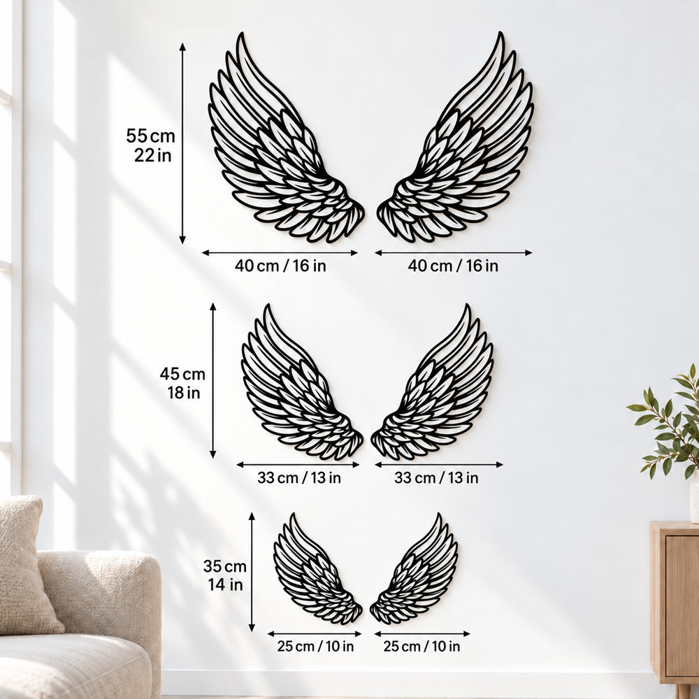 Black metal angel feather wings wall art with intricate cutout details displayed on the wall