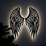 Black metal Angel wings wall art with Soft White LED Lighting displayed on the wall
