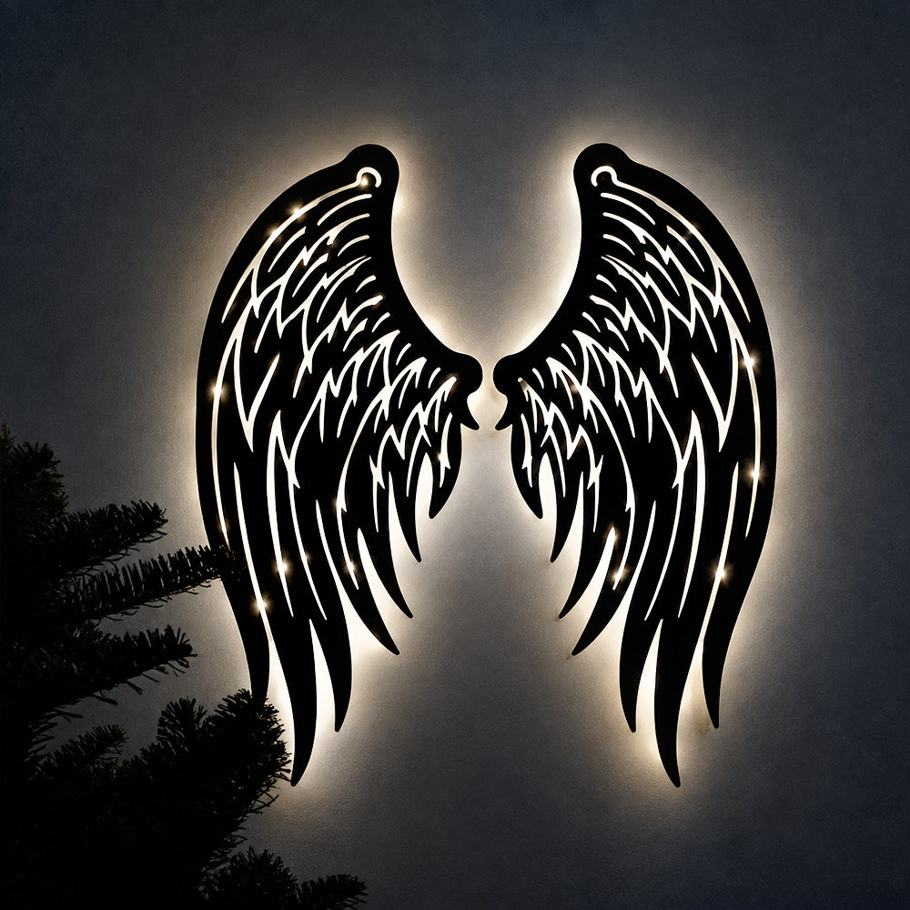 Black metal Angel wings wall art with Soft White LED Lighting displayed on the wall