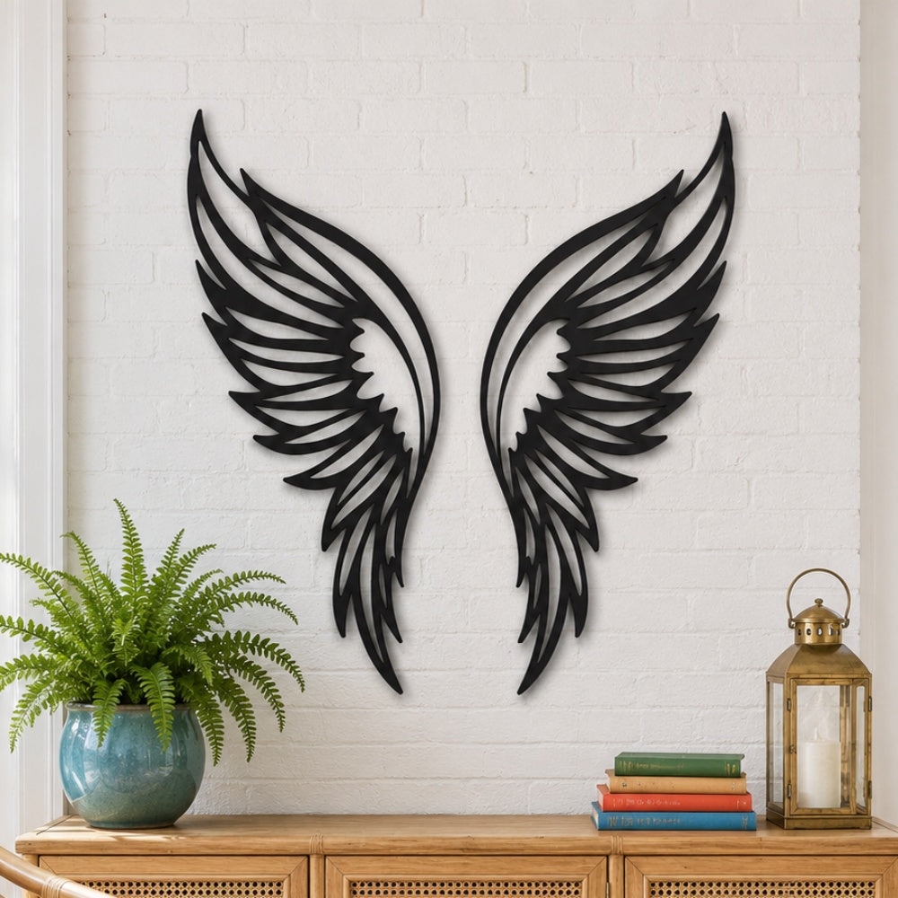 Black metal Butterfly wings wall art with intricate cutout details displayed on the wall
