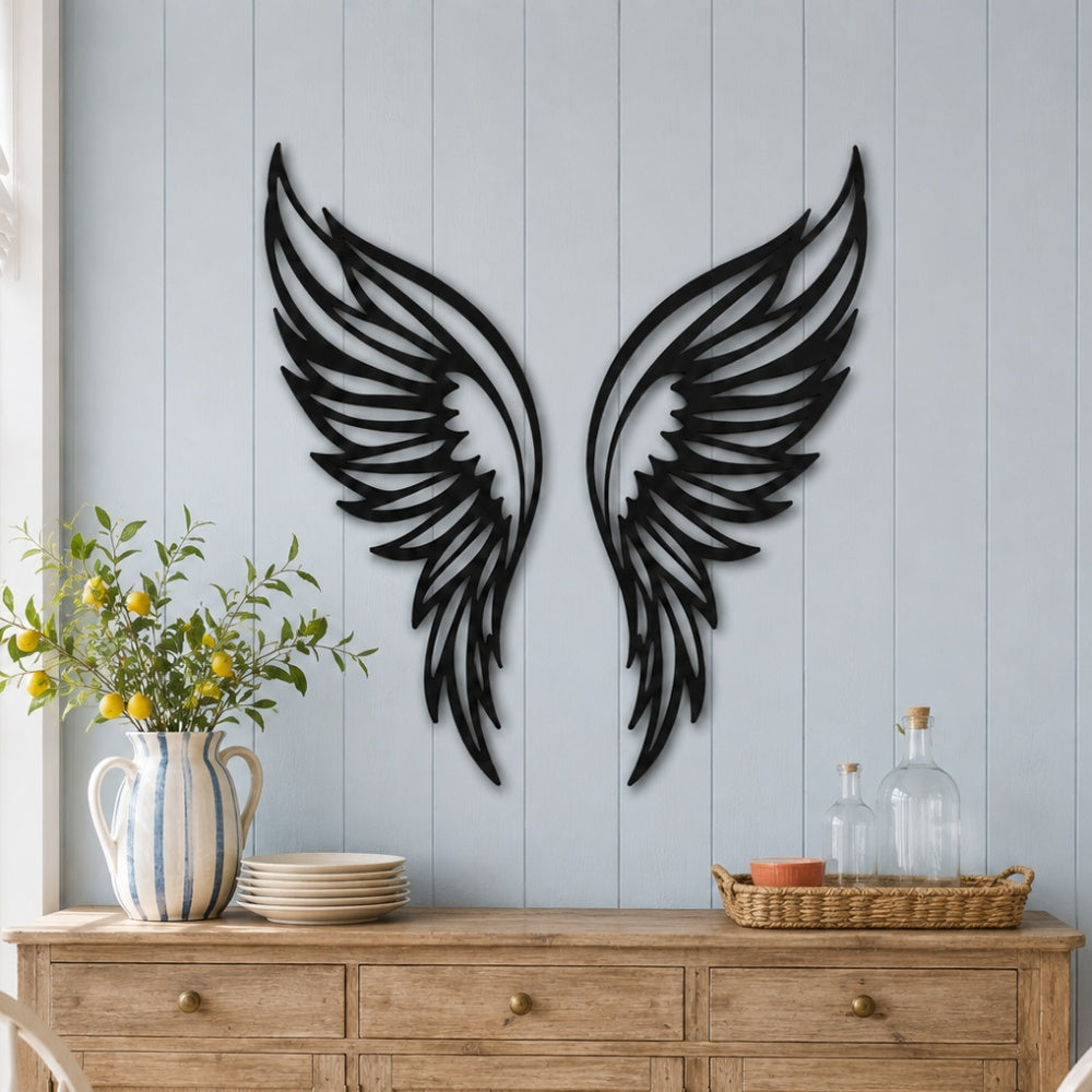 Black metal Butterfly wings wall art with intricate cutout details displayed on the wall