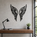 Black metal Butterfly wings wall art with intricate cutout details displayed on the wall