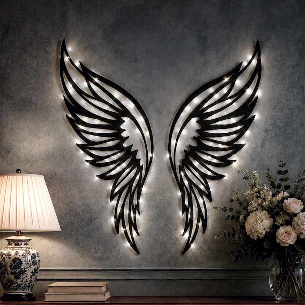 Black metal Butterfly wings wall art with Soft White LED Lighting displayed on the wall