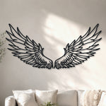 Black metal Celestial Angel wings wall art with intricate cutout details displayed on the wall