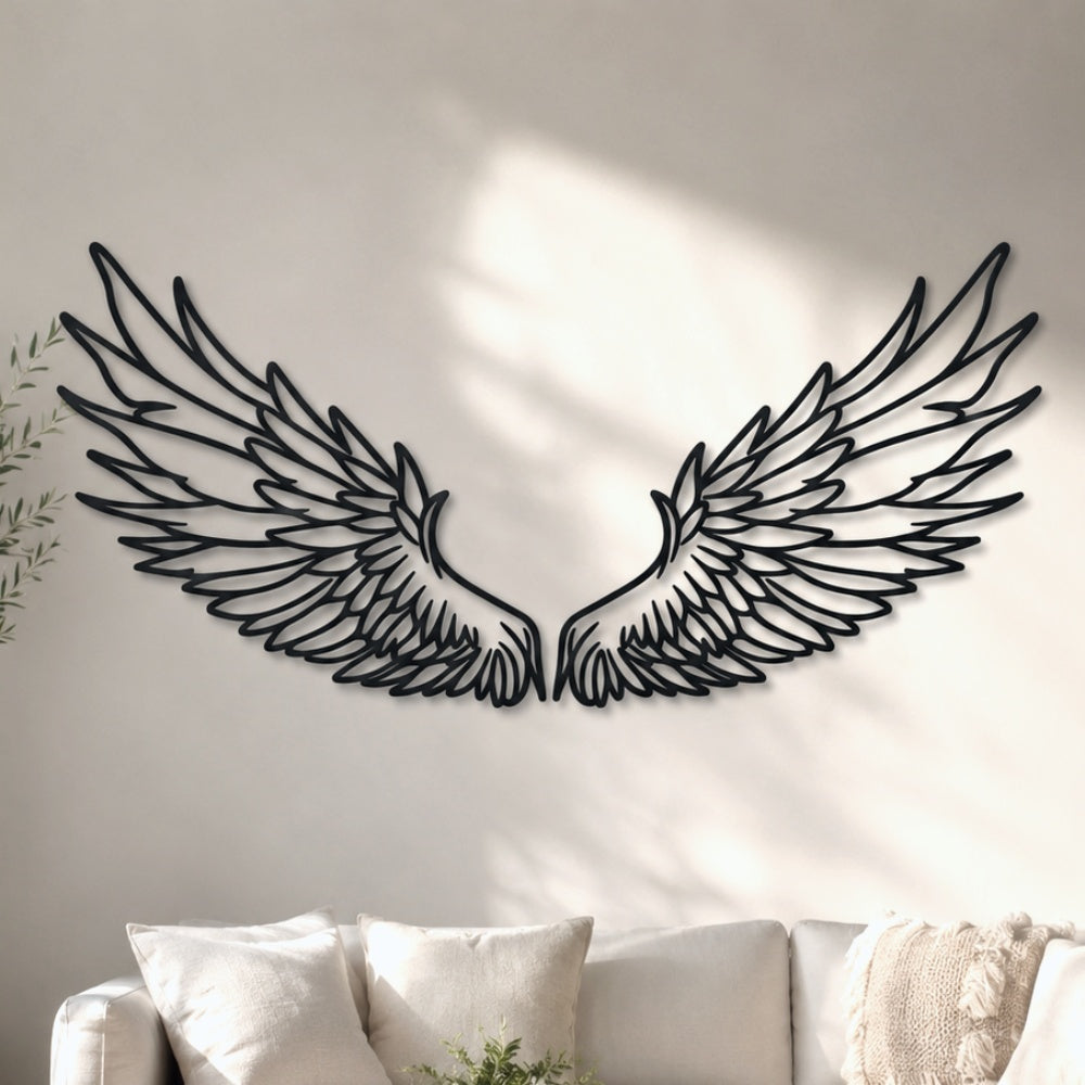 Black metal Celestial Angel wings wall art with intricate cutout details displayed on the wall