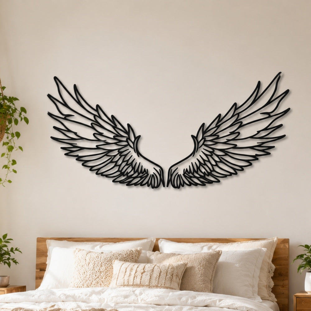 Black metal Celestial Angel wings wall art with intricate cutout details displayed on the wall