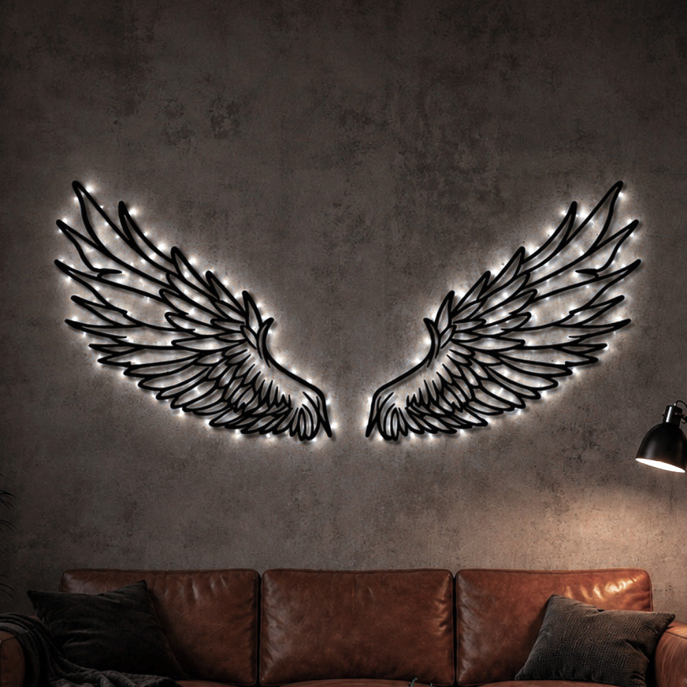 Black metal Celestial Angel wings wall art with Soft White LED Lighting displayed on the wall