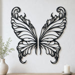 Black metal Elegant Butterfly wings wall art with intricate cutout details displayed on the wall