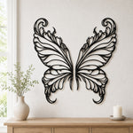 Black metal Elegant Butterfly wings wall art with intricate cutout details displayed on the wall